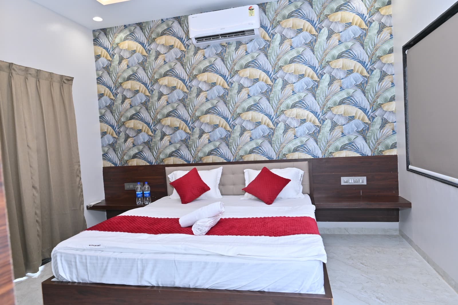 Super Deluxe Room double bed and air conditioner